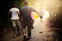 Family walking down to the beach