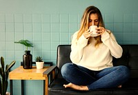 Girl having a hot cup of coffee