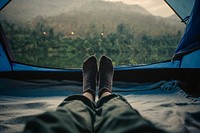 Woman sleeping in a tent with an amazing view