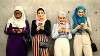 Group of muslim girls using smart phones