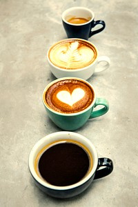Variety of cups with hot coffee