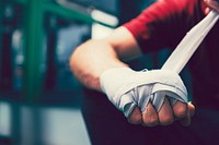 MuayThai boxer bandaging his fist