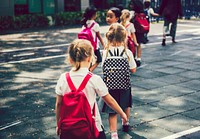 Happy kids walking at an elementary school
