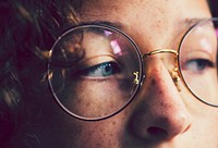 Girl with freckles wearing glasses