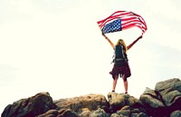 Woman holding up American flag