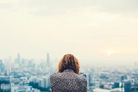Woman looking over massive city