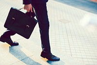 Man carrying his briefcase to work