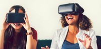 Women experiencing virtual reality with goggles