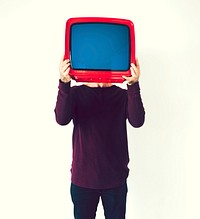 Man standing and holding a TV