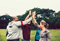 Team stacking hands before a race