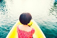 Asian girl on a yellow kayak
