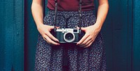 Woman holding an analog camera