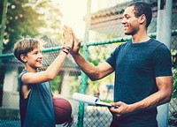 Young basketball player and his coach