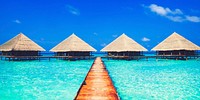 Huts in the blue sea of Maldives