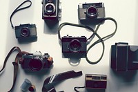 Flat lay of vintage analog cameras