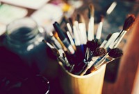 Closeup of paintbrushes in a cup