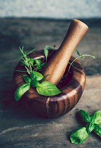 Basil and rosemary in a mortar