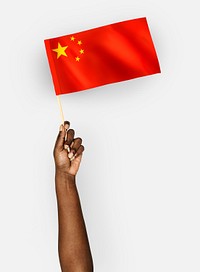 Person waving the flag of the People&#39;s Republic of China