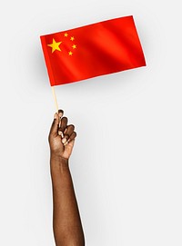 Person waving the flag of the People&#39;s Republic of China