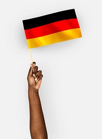 Person waving the flag of Federal Republic of Germany