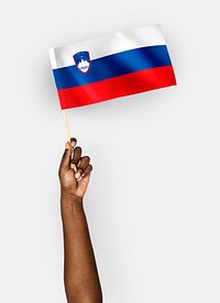 Person waving the flag of Republic of Slovenia