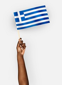Person waving the flag of Greece