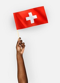 Person waving the flag of Switzerland