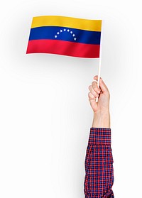 Person waving the flag of Bolivarian Republic of Venezuela