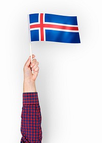 Person waving the flag of Iceland