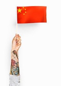 Person waving the flag of the People&#39;s Republic of China