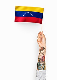 Person waving the flag of Bolivarian Republic of Venezuela