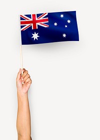 Person waving the flag of Commonwealth of Australia