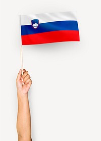 Person waving the flag of Republic of Slovenia