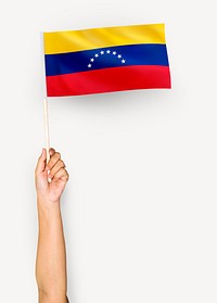 Person waving the flag of Bolivarian Republic of Venezuela