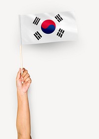 Person waving the flag of South Korea