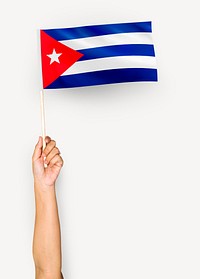 Person waving the flag of Republic of Cuba