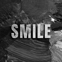 Smile uppercase letters typography on brush stroke background