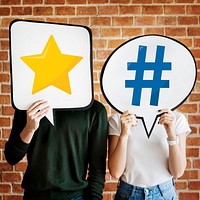 Young couple holding social media icons
