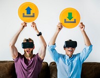 Two men with VR goggles holding technology signs
