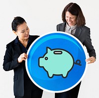 Businesswomen holding a piggy bank icon