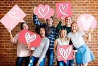 Young adult friends holding heart icons