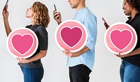 Diverse people holding valentine icons