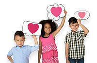 Happy kids holding speech bubbles with heart icons