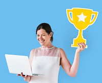 Woman holding a trophy icon and using a laptop