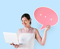 Woman holding a speech bubble and using a laptop