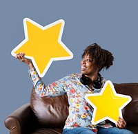 Cheerful woman holding golden stars icons