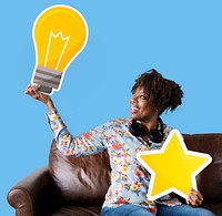 Woman showing light bulb icon on couch