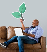 Man holding plant icon on couch