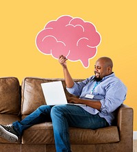 Man showing pink brain icon on couch
