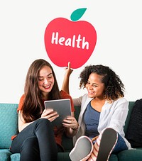Women showing a healthy apple icon and using a tablet